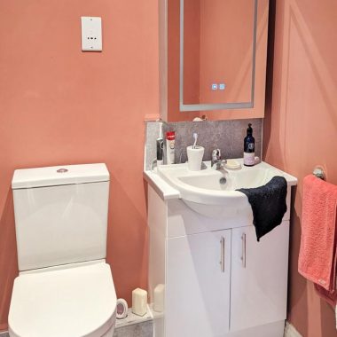 AFTER: Accessible ensuite with new walk-in shower, toilet, and sink