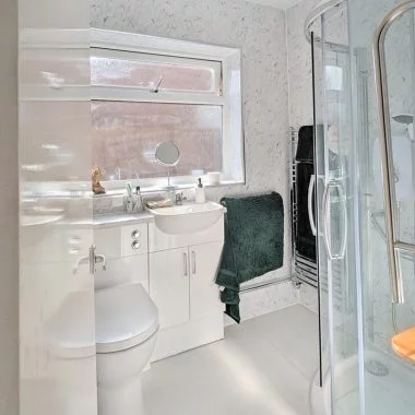 AFTER: Mobility bathroom with walk-in shower and seated bathing