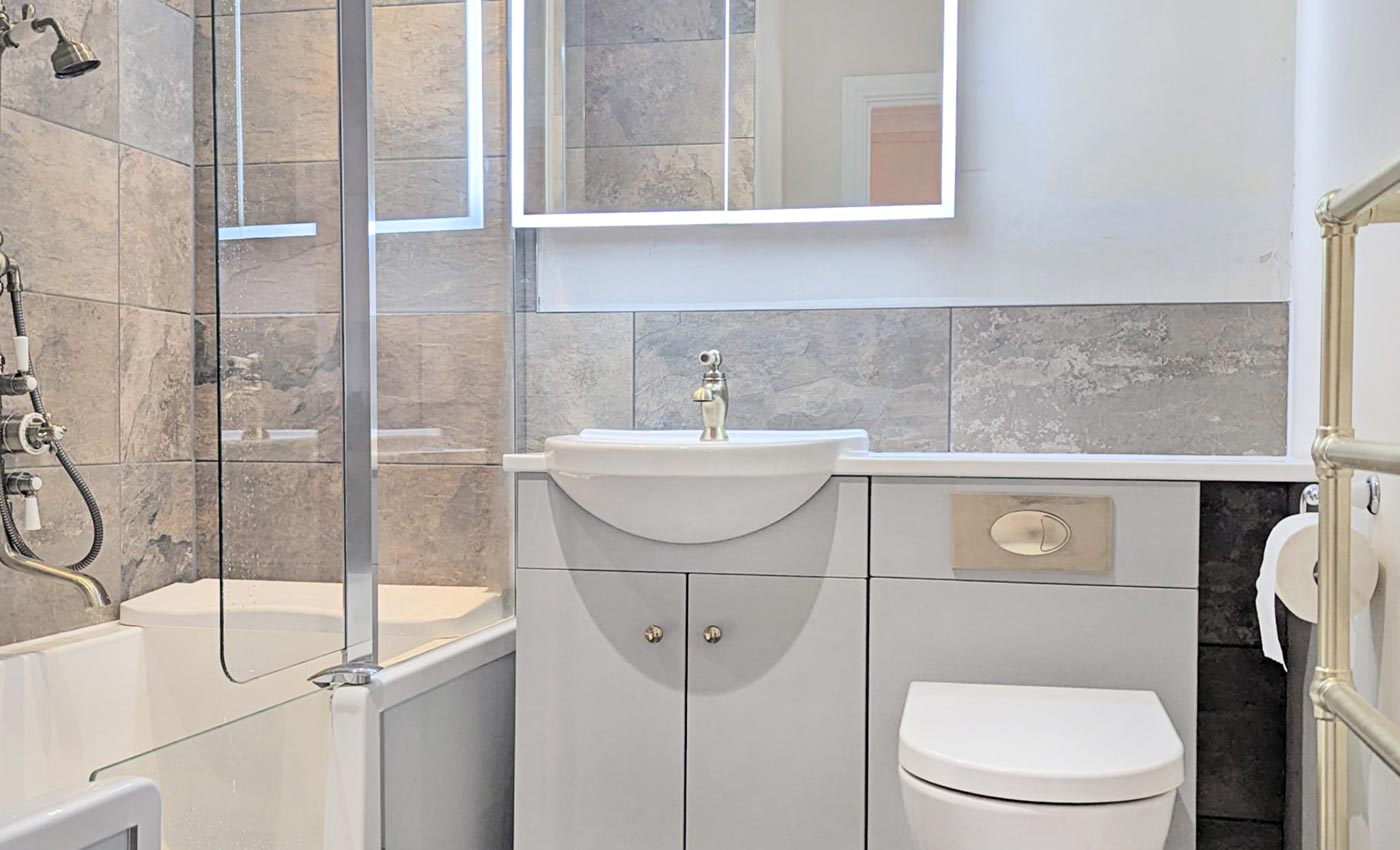 Walk-in bath with an accessible shower