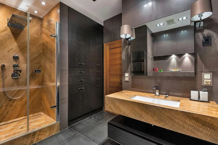 Shower room with dark stone facing