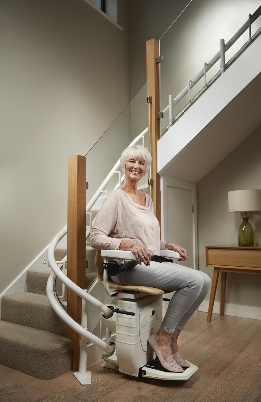 bespoke-home-stairlift-900b Older woman sitting on a stairlift