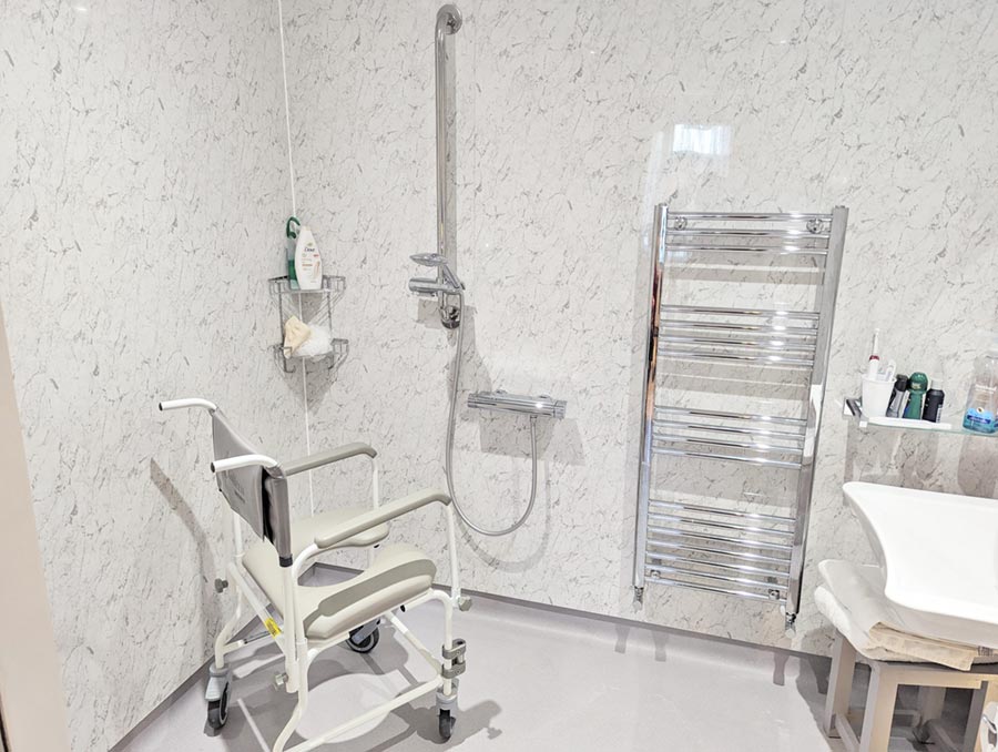 walk-in-shower-900b Wet room with shower, sink and toilet