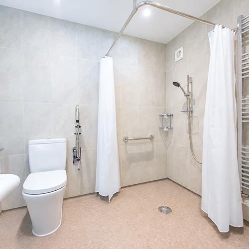 Level-access wet room created as part of a garage conversion.