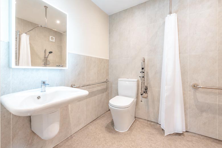 level-access-wetroom-780a Level-access wetroom with comfort-height toilet, accessible sink and level-access, slip-resistant floor.