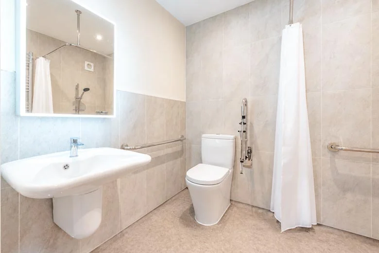 level-access-wetroom-780a Level-access wetroom with comfort-height toilet, accessible sink and level-access, slip-resistant floor.